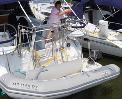 Our Colleen hoisting dinghy.